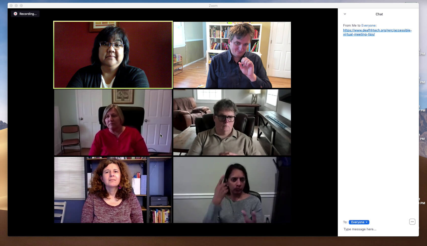 Video conference with six participants; four women and two men. Two of the participants are signing, while the others are watching. A chat pane shows a web URL under discussion.