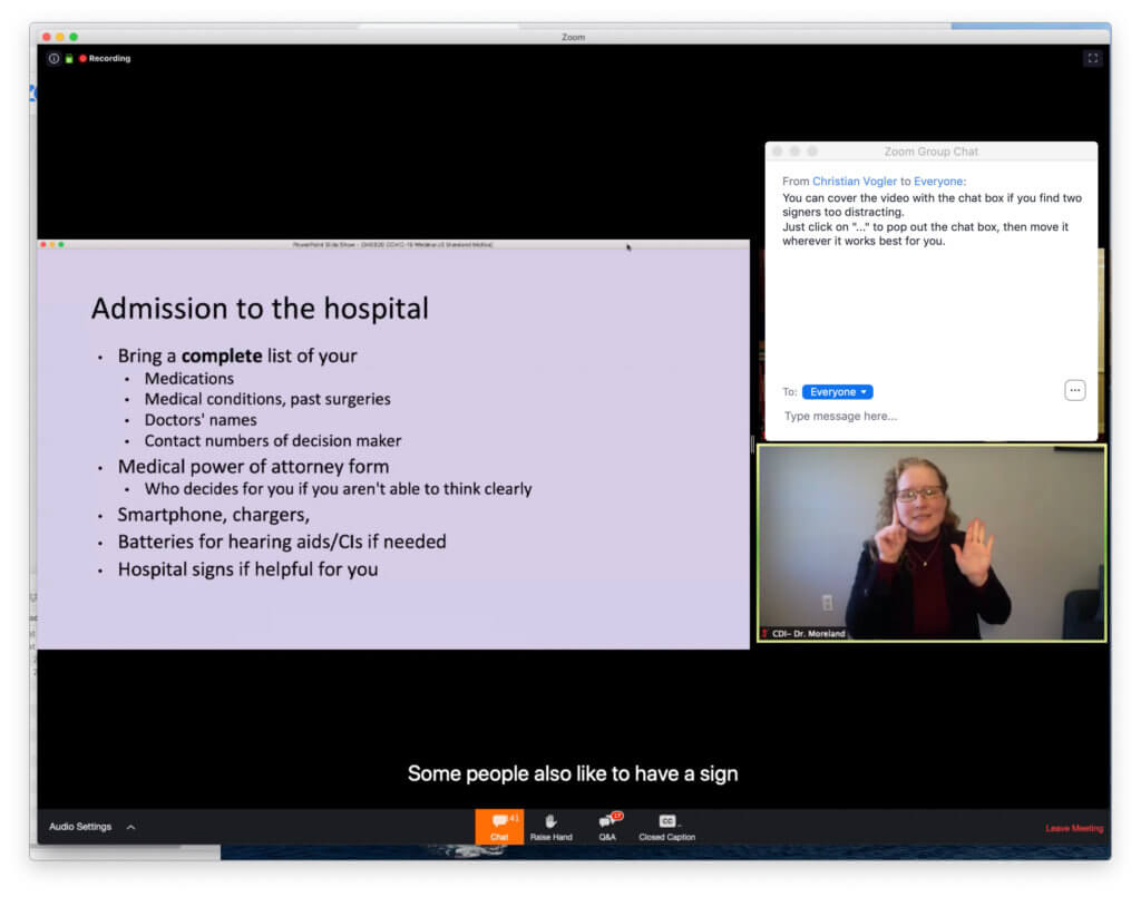 View of one signer covered with chat box. A slide show is show in the Zoom app on the left side of the window. A divider separates two stacked videos. The Zoom chat box, in a separate window, covers the panelist, leaving only the CDI visible.
